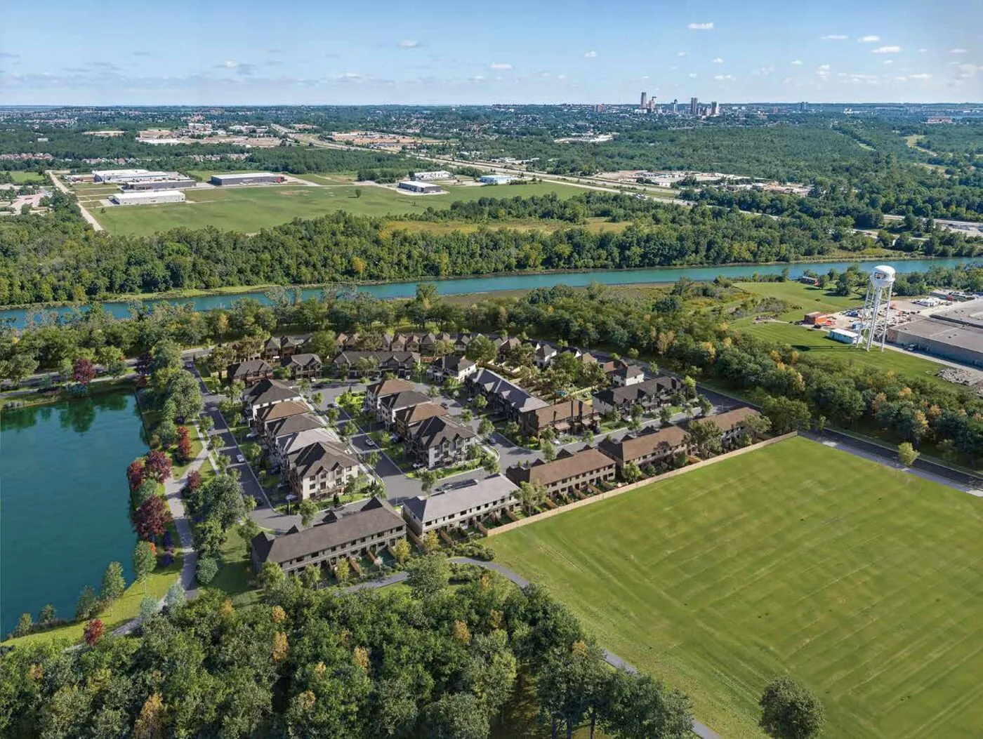 Aerial view of an established Empire Homes community beside a river and open greenspace